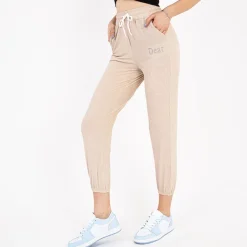 New Beżowe damskie spodnie materiałowe z naszywką Spodnie Materiałowe