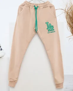 Sale Beżowe damskie spodnie dresowe z kolorową naszywką Spodnie Dresowe
