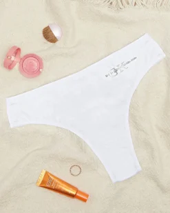 Białe bawełniane damskie majtki typu stringi z napisem Stringi