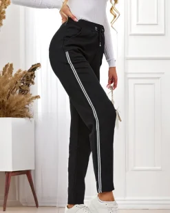 Online Czarne damskie spodnie dresowe z lampasami Spodnie Dresowe