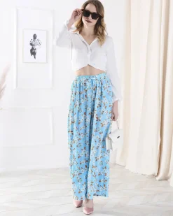 Sale Damskie niebieskie spodnie materiałowe w kwiatki Spodnie Materiałowe