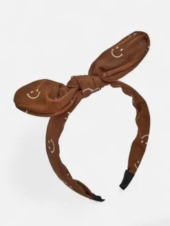 Best Dziecięca opaska do włosów z kokardką z printem w uśmiechnięte buźki Damskie Akcesoria Do Włosów