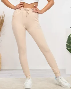 Online Jasnobeżowe damskie spodnie dresowe z cyrkoniami Spodnie Dresowe