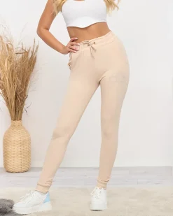 Online Jasnobeżowe damskie spodnie dresowe z cyrkoniami Spodnie Dresowe