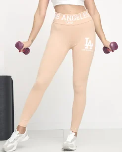 New Pudrowe damskie prążkowane legginsy z białymi napisami Legginsy / Tregginsy