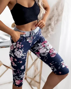 Discount Spodenki damskie granatowo- różowe o długości 3/4 Spodenki 3/4|Krótkie Spodenki