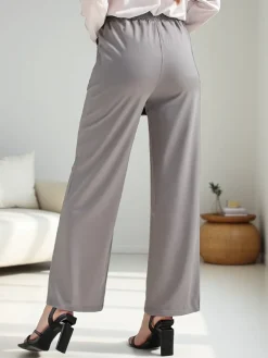 Szerokie spodnie damskie z ozdobną klamerką Spodnie Materiałowe