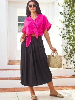 Wiskozowa Damska spódnica midi letnia i zwiewna z dwoma kieszeniami Spódnice