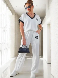 Sale Wiskozowy damski komplet z krótkim rękawem i poszerzanymi spodniami Damskie Komplety Damskie